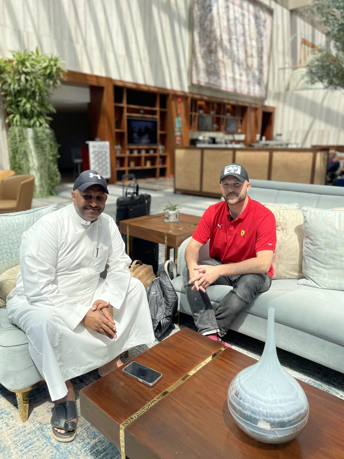 Dimitry with his Saudi partner in a hotel lobby