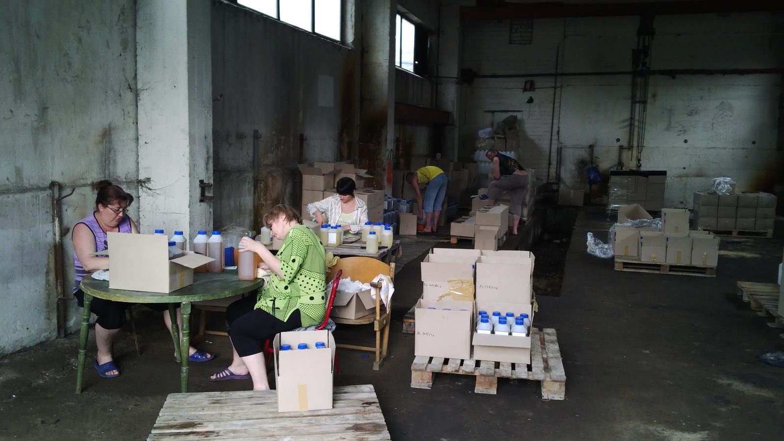 Hand-packing bottles at the production site