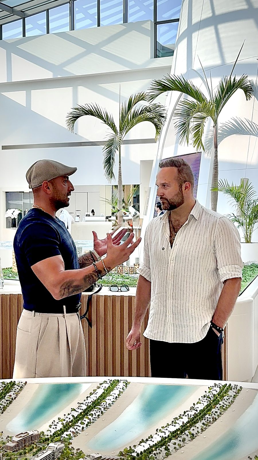 Dimitry talking with a developer at a Dubai sales centre