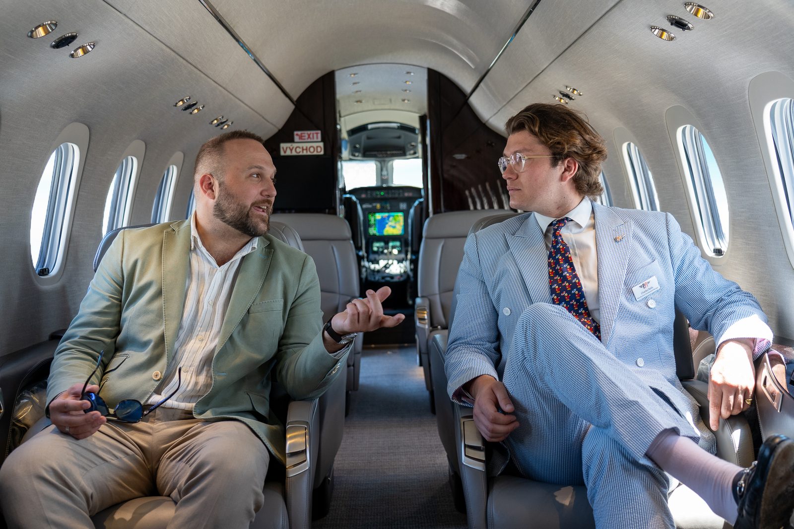 Dimitry talking business aboard a private jet